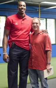 We're not really twins. Dwight Howard and I just happened to be wearing red shirts and jeans. This was taken after I interviewed him for an Orlando magazine cover story in August, 2011.